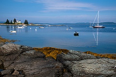 Boats Moored Near Pumpkin Island Light Near Rocky Shore